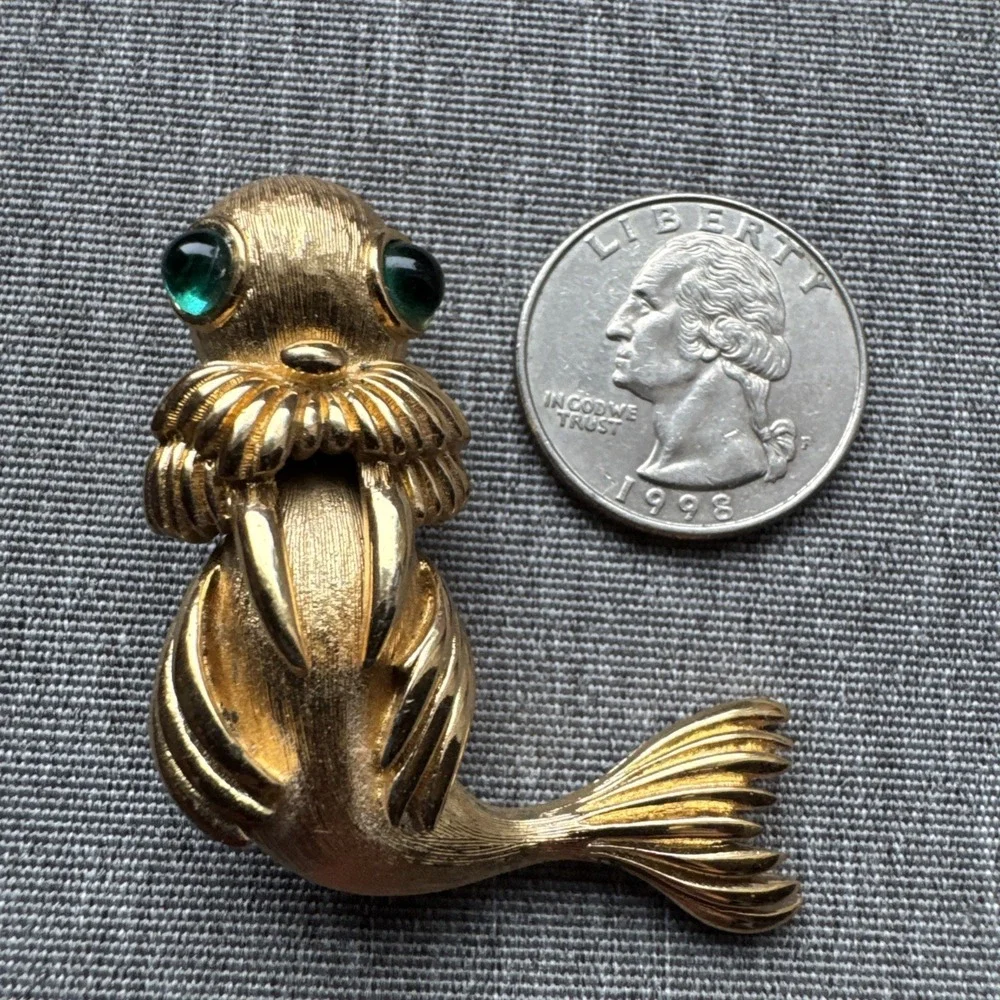 Vintage Monet Sea Lion Figural Brooch Gold‎ Tone Green rhinestone Cabochon Eyes